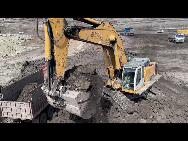 Liebherr 974 Excavator Loading Mercedes And MAN Trucks - Ascon Ltd