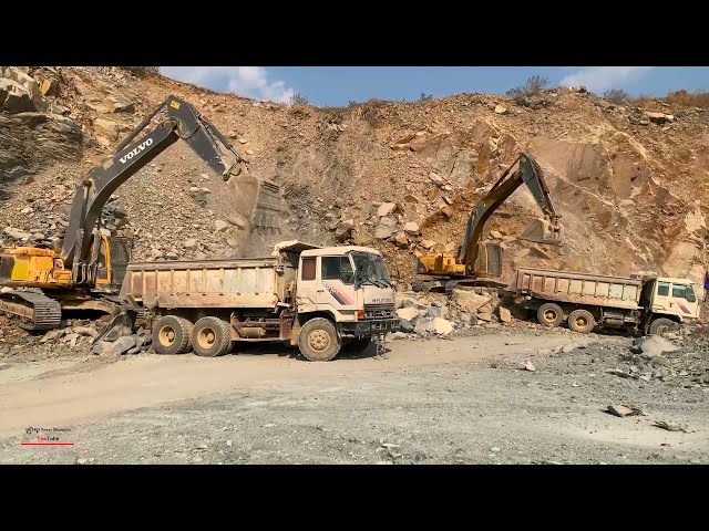 awesome stronger rocks digging removing into dump truck operating volvo excavators