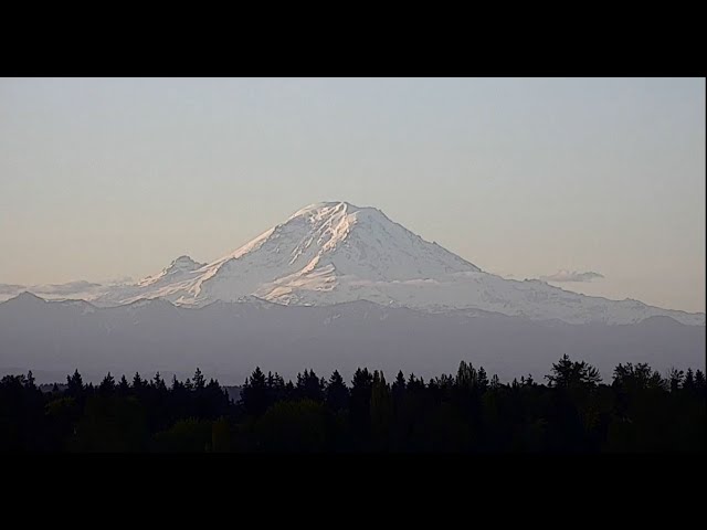 The sun rises over Mount Rainier