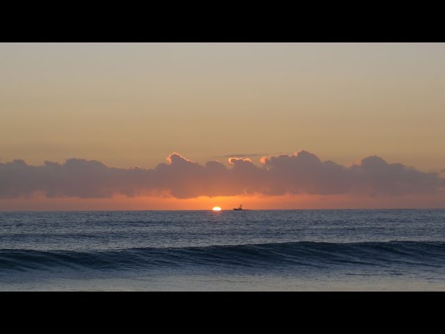 Awesome sunrise in Boca Raton, FL - 2/25/17 with yachts & kayaker and sun breaching horizon