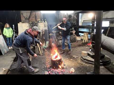 Iron smelting in bloomery furnace in water-powered forge in Gdańsk-Oliwa