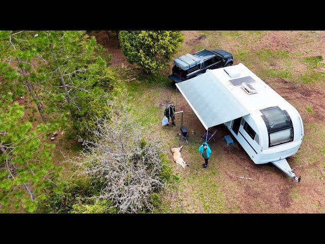 LUXURY CARAVAN CAMPING IN FOREST WITH STOVE UNDER HEAVY RAIN