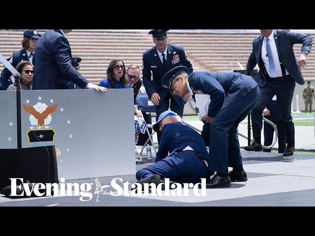 Moment Joe Biden falls over after speech to US air force academy graduates