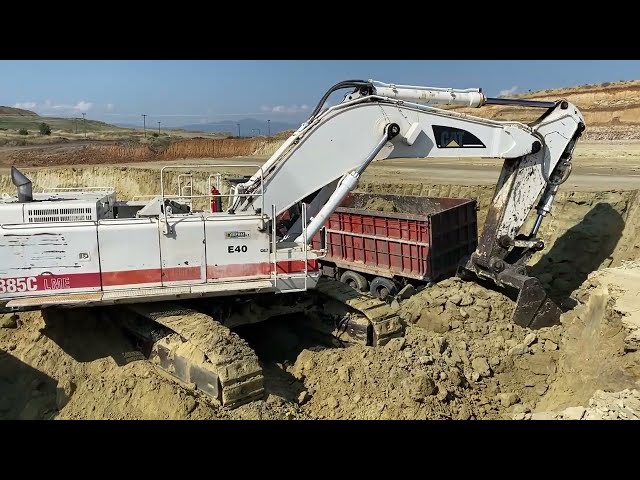 Caterpillar 385C Excavator Loading Mercedes & MAN Trucks - Interkat SA