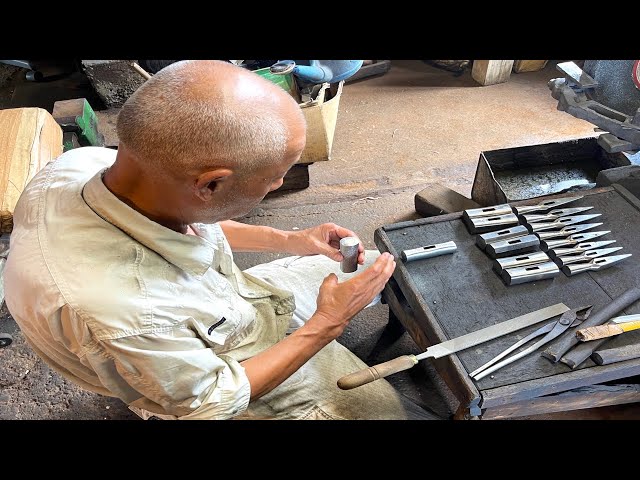 The process by which traditional Japanese hammers are made. 70-year-old Japanese hammersmith.