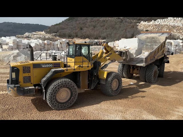 Komatsu WA600 Wheel Loader Unloading Marble Blocks From Cat Dumpers At Danae Marble Quarry-4k