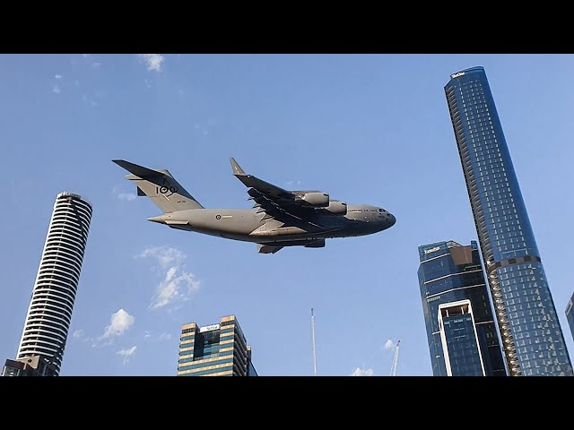 Giant Plane Flies Between Buildings