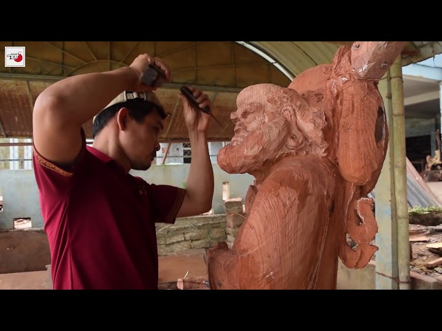Making a huge wooden Buddha
