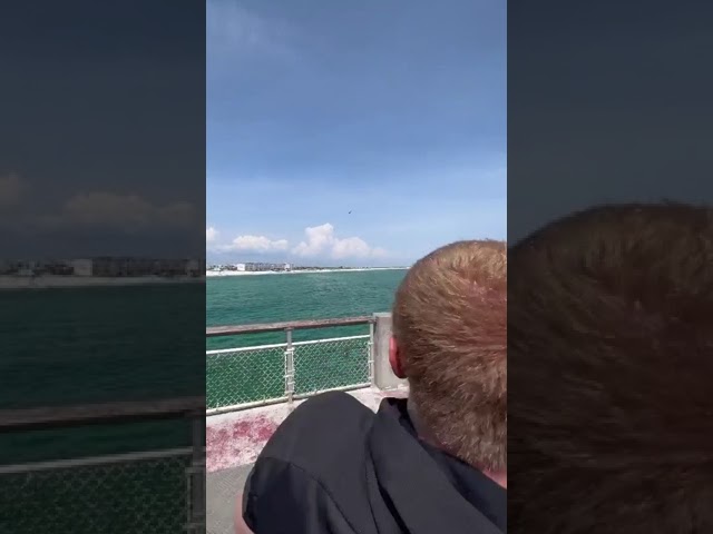 Kid throws fish off a pier part 2