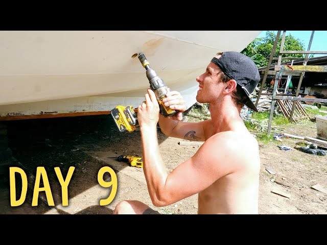 Drilling important holes in a 2 inches wooden boat's hull — Sailing Yabá 177