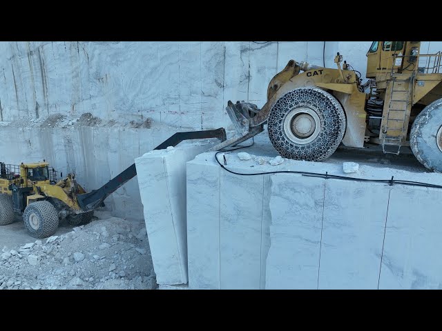 Huge Komatsu And Caterpillar Wheel Loaders Working Hard On Birros Marble Quarry - 4k