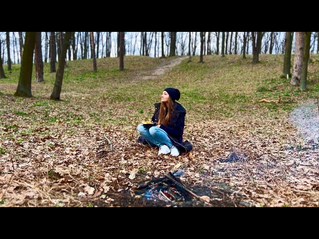 Girl alone in the forest. Cooking bushcraft