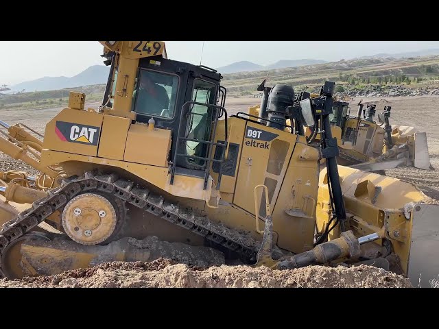 Two Caterpillar D9T Bulldozers Working On Huge Mining Area