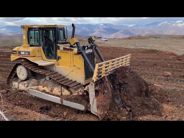 Caterpillar D6R Bulldozer Leveling The Ground On Huge Construction Project