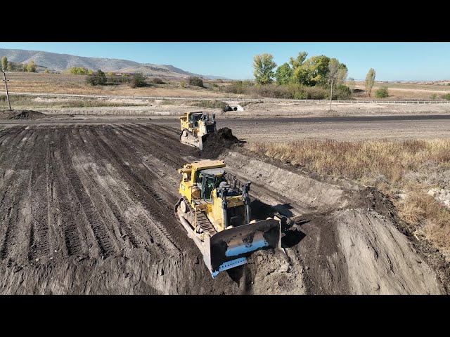 Two Caterpillar D9T Bulldozers Levelling A Huge Mining Area - 4k