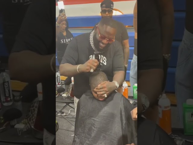 Rick Ross giving out haircuts.