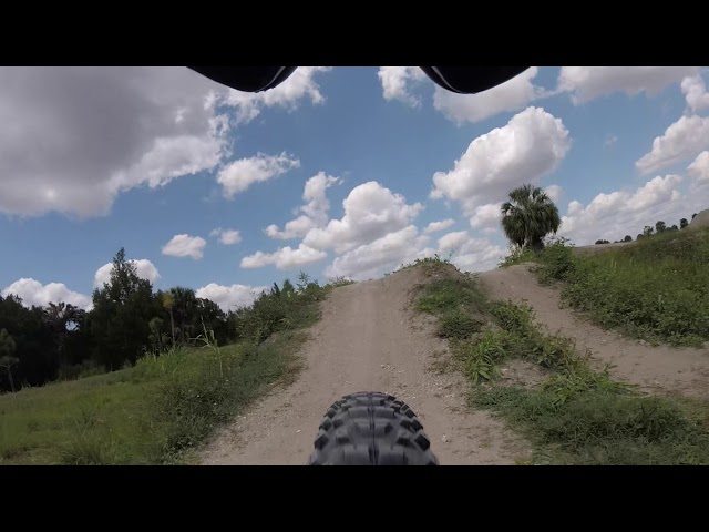 Playing around on the pump track under construction at Caloosahatchee Regional Park in Alva, Florida