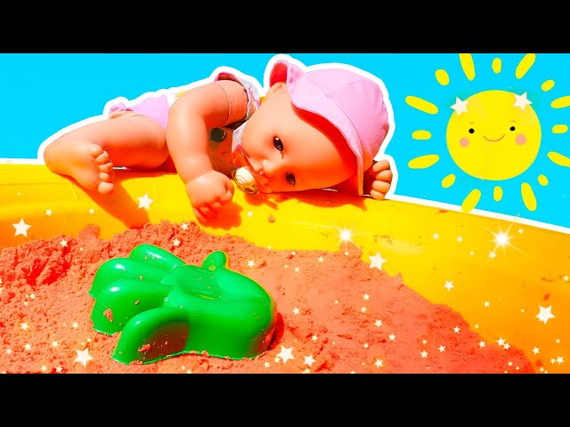 Baby Annabell doll goes for a walk. Baby Born doll plays with colorful sand. Feeding baby doll.