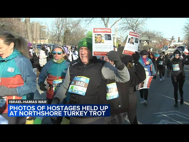 Highland Park runners hold photos of Israeli hostages during annual Thanksgiving 'Turkey Trot'