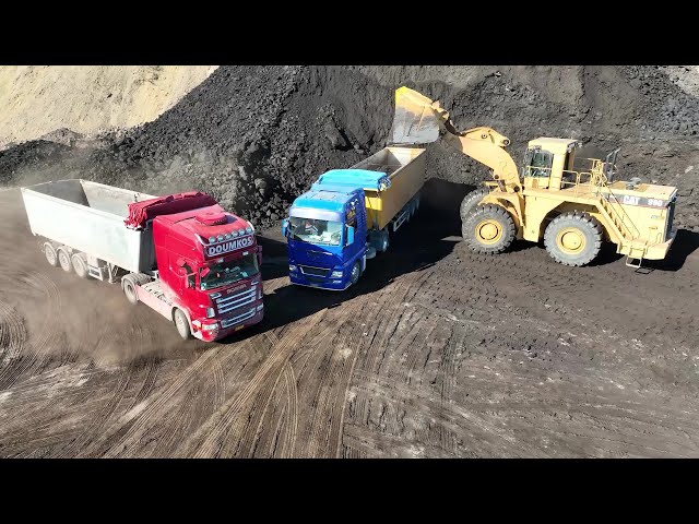 Caterpillar 990 Wheel Loader Loading Lorries With Two Passes - S.G.M Melidis - Drone View