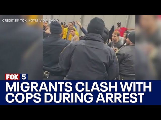 Migrants clash with cops during arrest